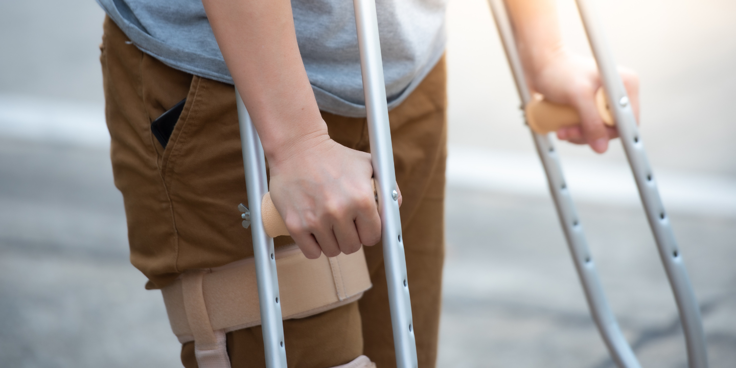 Image of a person on crutches